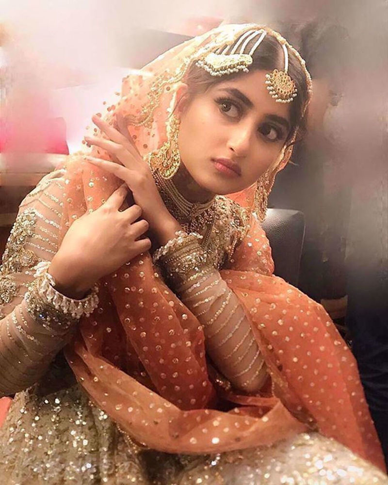 Picture of Sajal Aly looking regal in this burnt orange piece of perfection by Nomi Ansari