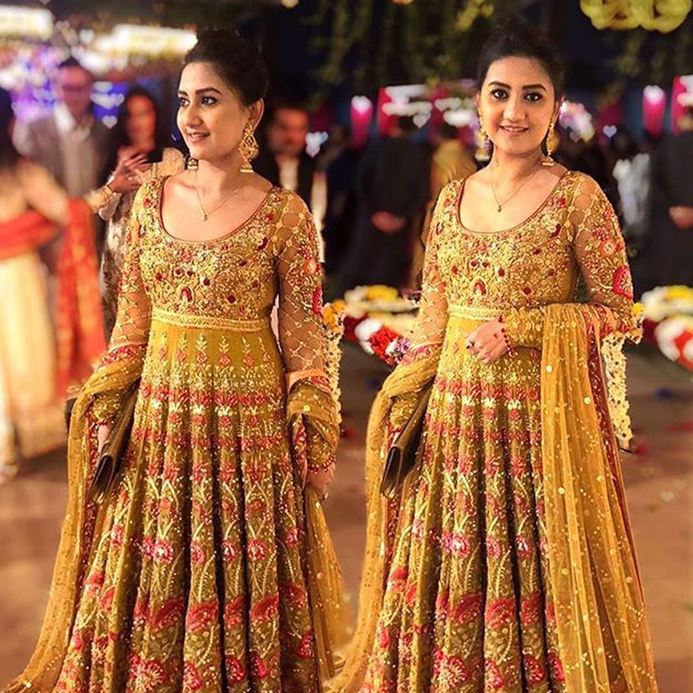 Picture of FaizaAnsari spotted in a #saffron heavily embellished peshwas with #red and #pink details and paired with a heavy tulle net #dupatta