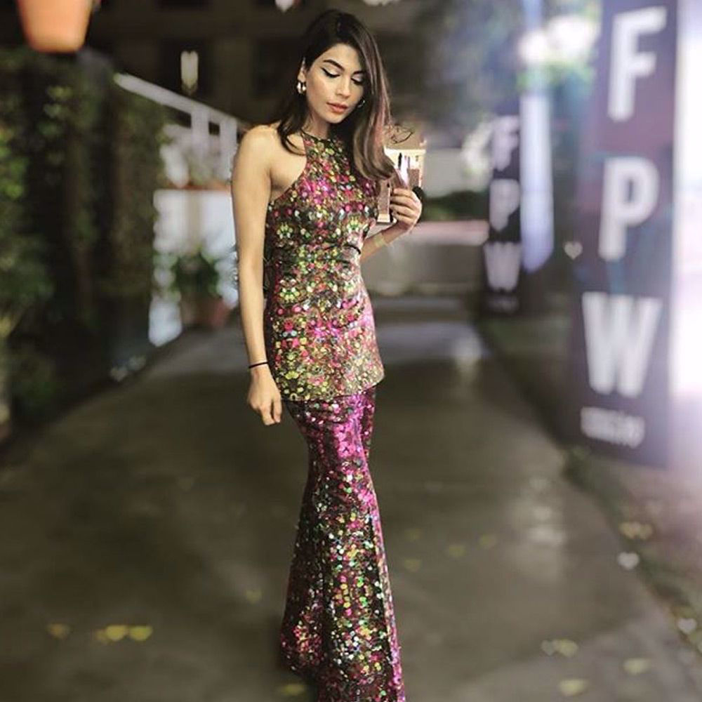 Picture of Amna Babar spotted in a printed silk halter shirt with a wide legged flared pants