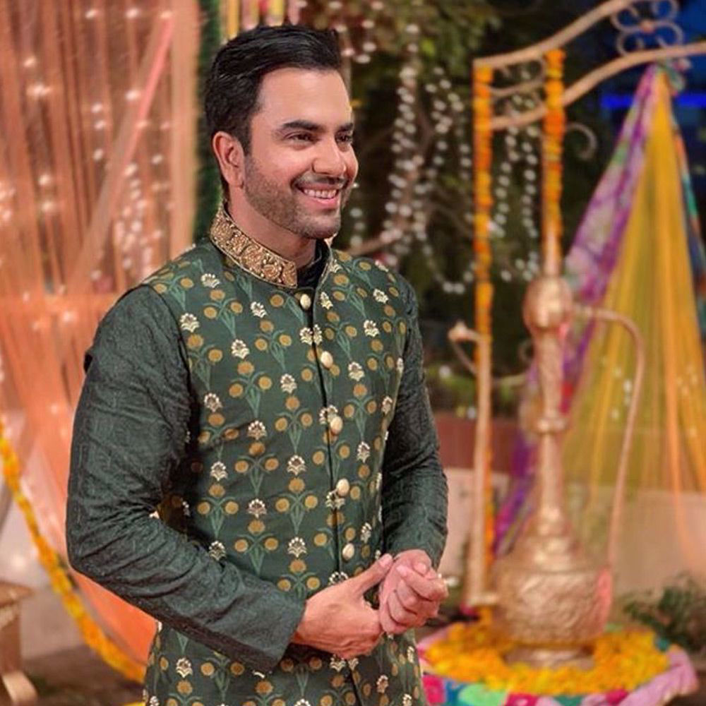 Picture of The rockstar @calljunaidkhan wears an embellished printed deep olive waistcoat paired with an embroidered kurta and straight pants