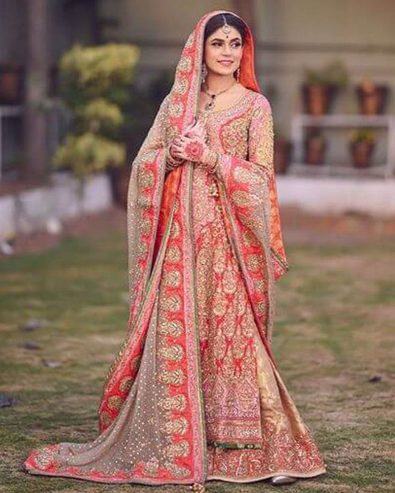 Picture of With accents of pink, peach and green, Mehak’s classic red and gold bridal is absolutely timeless!